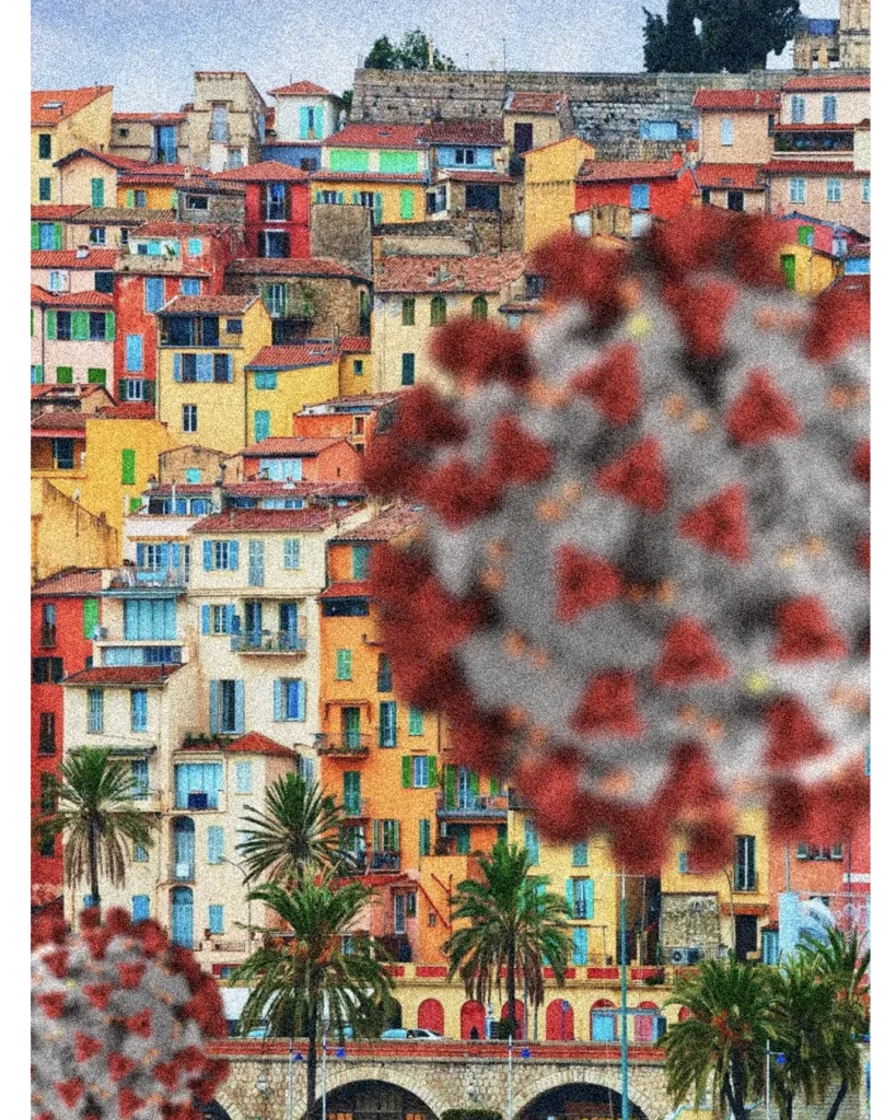 Fotografia de uma cidade colorida com a representação gráfica do coronavírus sobreposta em primeiro plano. A imagem possui textura granulada e simboliza o impacto da COVID-19 no cotidiano urbano.